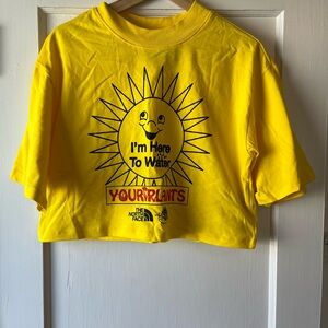 The North Face / Online Ceramics Cropped Yellow Sun Graphic Tee